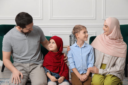 Happy Muslim family spending time together at home