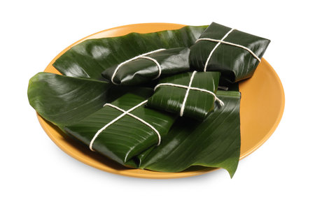 Cut banana leaves with food isolated on white. Eco servingの写真素材