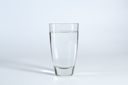 Refreshing soda water in glass on white backgroundの写真素材