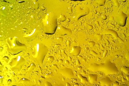 Water drops on color glass surface, macro viewの写真素材