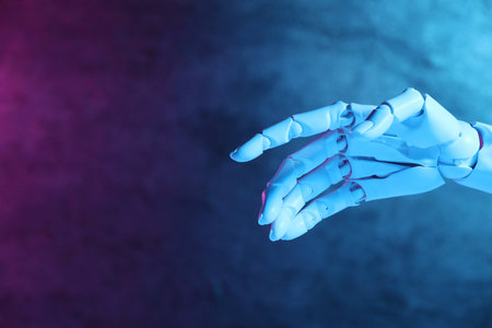 Artificial intelligence. Robot hand gesturing on blurred background in neon lights, space for textの写真素材