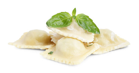 Delicious ravioli with cheese and basil isolated on whiteの写真素材
