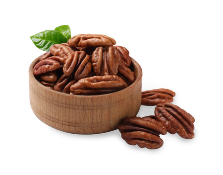 Tasty pecan nuts and green leaves in bowl isolated on white