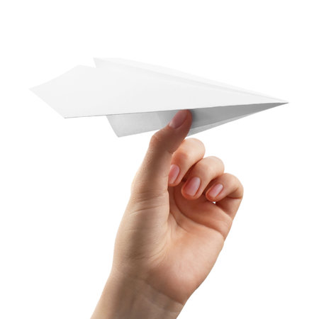 Woman with handmade paper plane on white background, closeupの写真素材