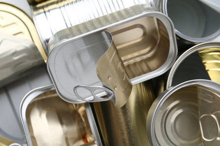 Many open tin cans as background, top viewの写真素材
