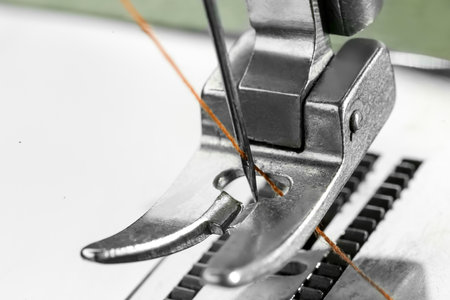 Sewing machine with thread on white background, macro viewの写真素材