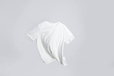 One stylish t-shirt in air on white backgroundの写真素材
