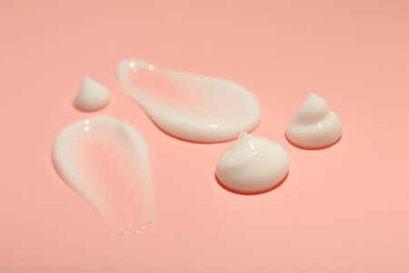 Cream samples on pink background, closeup. Skincare productの写真素材