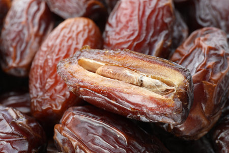 Many tasty dried dates as background, closeup