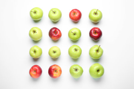 Red and green apples on white background, flat layの写真素材