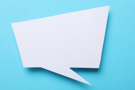Blank speech bubble on light blue background. Space for text