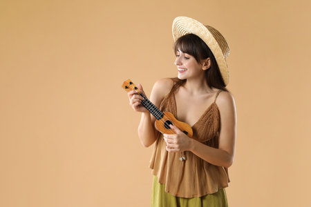 Happy woman playing ukulele, space for textの写真素材