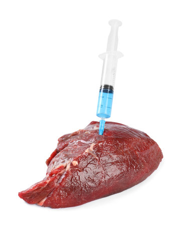 GMO concept. Piece of meat and syringe isolated on whiteの写真素材