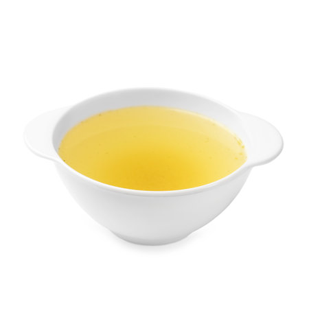 Tasty chicken bouillon in bowl isolated on whiteの写真素材