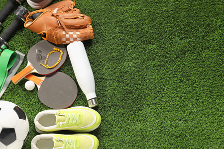 Different sports equipment on artificial grass, flat lay. Space for textの写真素材