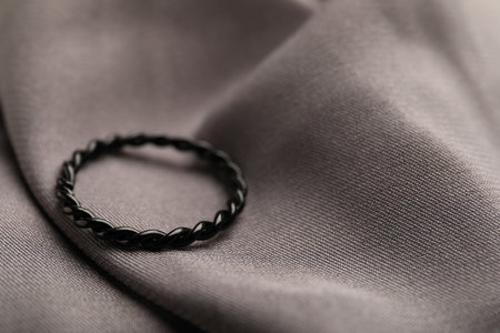 One stylish ring on gray cloth, closeupの写真素材
