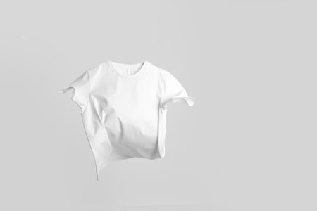 One stylish t-shirt in air on white backgroundの写真素材