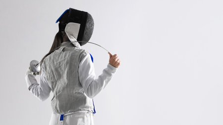 Fencer with epee on white background, space for text