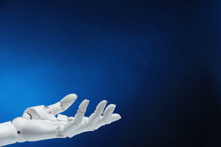 Artificial intelligence. Robot hand gesturing on dark blue background, space for textの写真素材