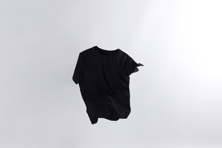 One stylish t-shirt in air on white backgroundの写真素材
