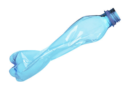 One crumpled plastic bottle isolated on whiteの写真素材