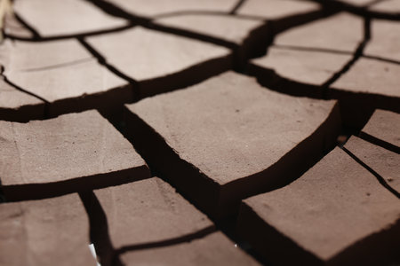 Dry cracked ground as background, closeup. Global warmingの写真素材