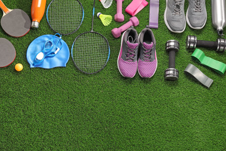 Different sport equipment on artificial grass, flat lay. Space for textの写真素材