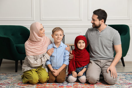 Happy Muslim family spending time together at homeの写真素材