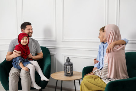 Happy Muslim family spending time together at homeの写真素材