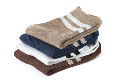 Stack of folded soft socks isolated on white