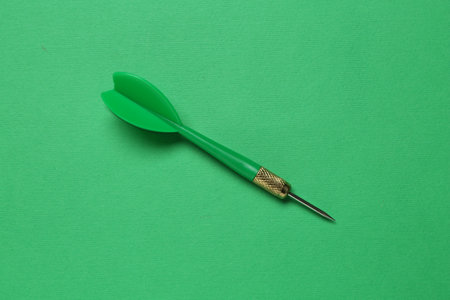 One dart arrow on green background, top viewの写真素材