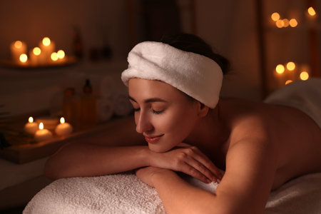 Young woman relaxing after massage in spa salonの写真素材