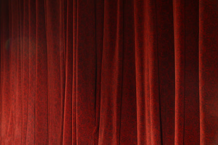 Elegant red curtains in theater as background, closeupの写真素材