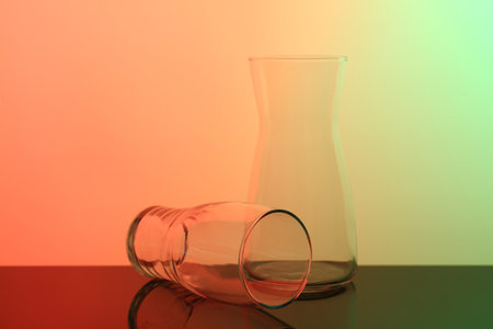 Empty glass and jug on table, color tone effectの写真素材