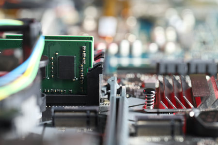 Computer motherboard with RAM chip as background, closeup. Electronic engineering