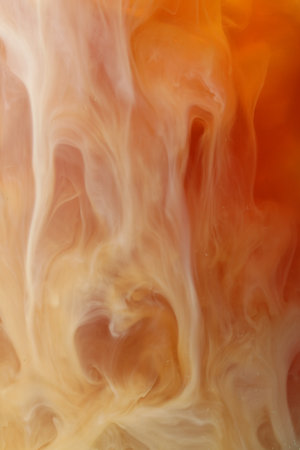 Refreshing coffee with ice and milk as background, closeup