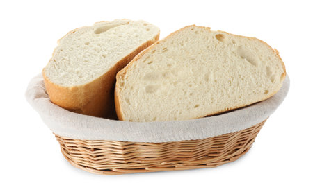Halves of fresh bread in wicker basket isolated on whiteの写真素材