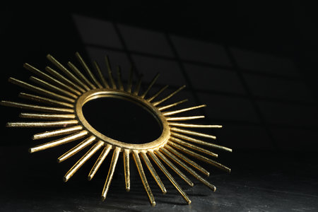 Stylish golden decor on black background, closeupの写真素材