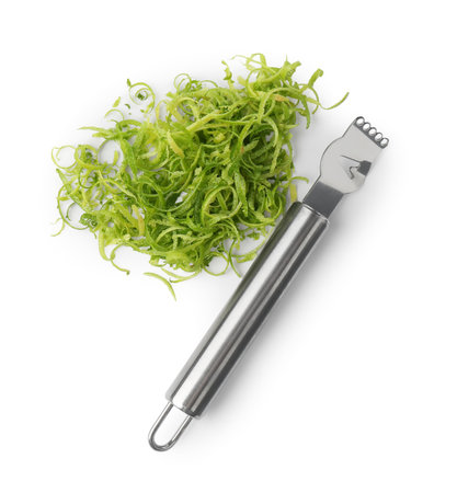 Lime zest and zester tool isolated on white, top viewの写真素材