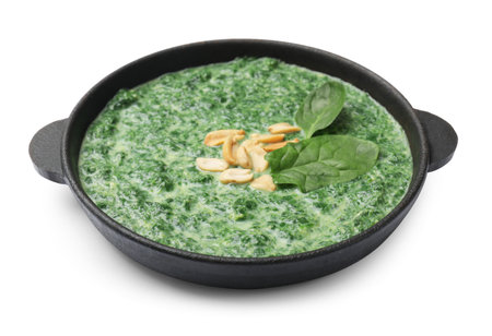 Delicious spinach sauce with peanuts isolated on whiteの写真素材