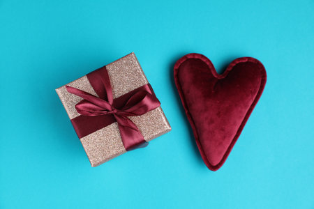 Romantic gift and heart on light blue background, top viewの写真素材