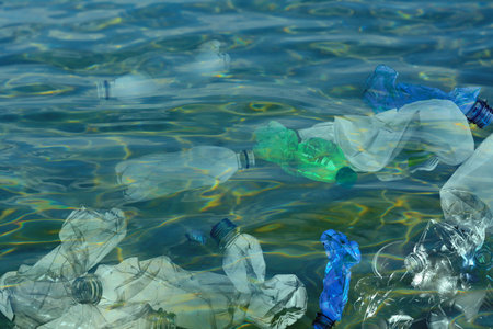 Environmental pollution. Ocean water with plastic garbage