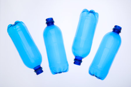 Empty plastic bottles on white background, top viewの写真素材