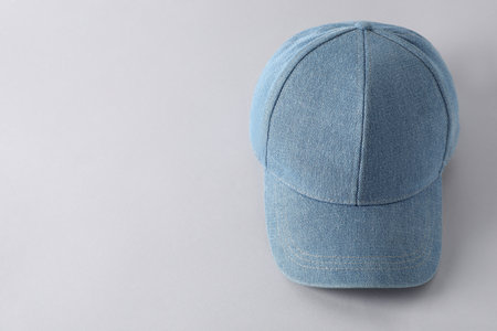Stylish denim baseball cap on light grey background, above view. Mockup for designの写真素材