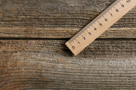 One ruler on wooden table, top view. Space for textの写真素材