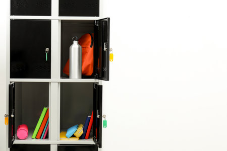 Lockers with school supplies on light background, closeup. Space for textの写真素材