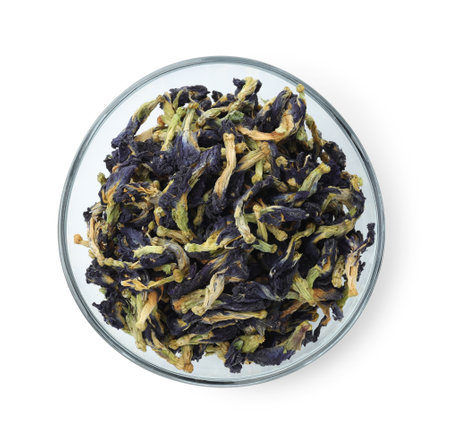 Butterfly pea flower tea. Dry Clitoria ternatea petals in bowl isolated on white, top viewの写真素材