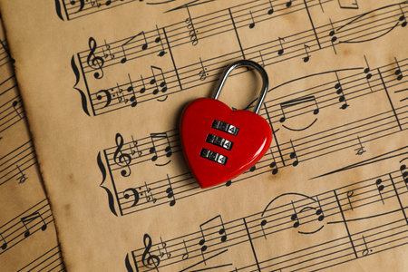 Heart shaped padlock on musical notes, closeupの写真素材