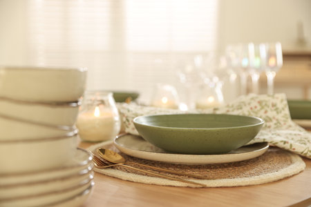 Stylish table setting with dishware and cutlery indoorsの写真素材