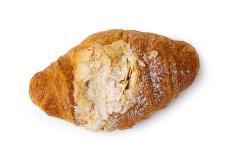 Delicious fresh croissant with almond flakes isolated on white, top viewの写真素材
